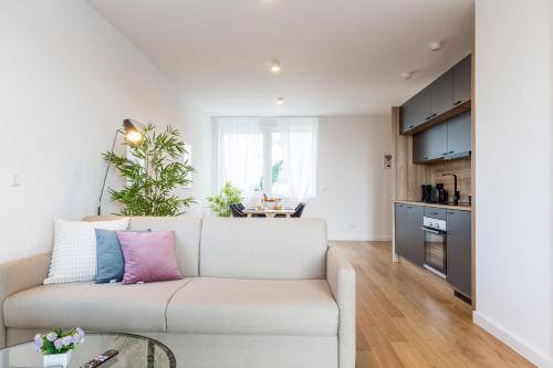 a living room with a couch and a table at living TIMELESS - Adler Apartments Sasbachwalden in Sasbachwalden