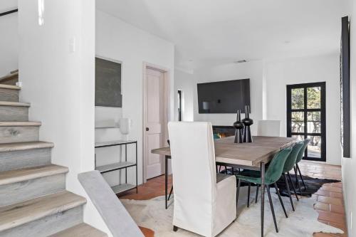 a dining room with a table and a television at Las Luces in Spicewood