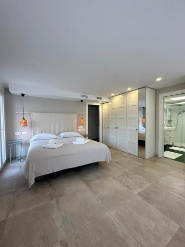 En eller flere senge i et værelse på Acogedor Bungalow - Club del Mar