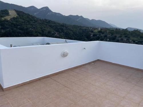 a white room with a view of a mountain at Penthouse With Breathtaking Panoramic Views of Mediterranean sea and Mountain in Akanthou