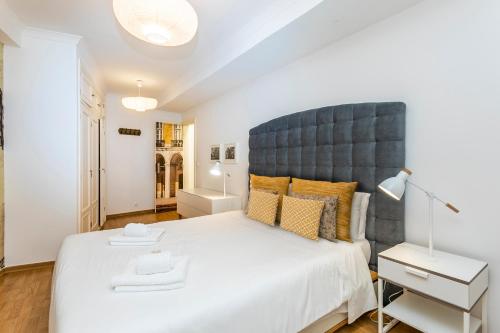 Postelja oz. postelje v sobi nastanitve Alfama Elétrico By SpotOn Apartments