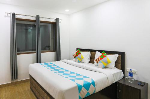 a bedroom with a large bed and a window at 79600 The Premium Villa in New Delhi