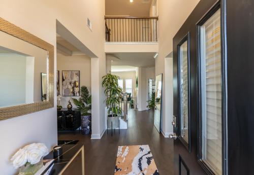 a hallway of a home with a living room at Luxury Bedroom with Private Bath in Hampton