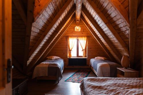 En eller flere senge i et værelse på Green Cottage