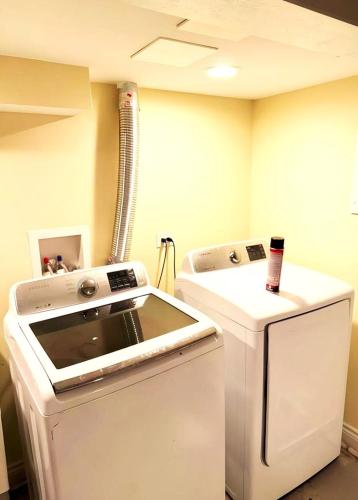 a kitchen with a stove and a refrigerator at Fully Equipped Cozy 4/5 BR in Chicago