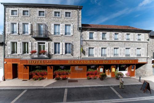 a building with a hotel in front of it at Logis SPA Hotel Restaurant De La Poste in Tence