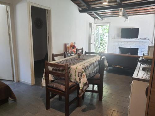 a dining room table with a cheetah table cloth on it at Casa acogedora y funcional in Atlántida