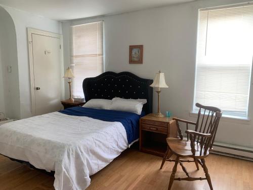 a bedroom with a bed and a desk and a chair at 2131 in Philadelphia