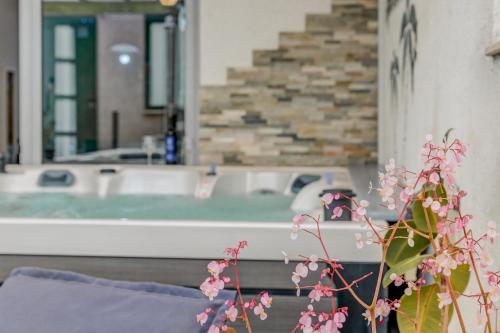 a bath tub in a bathroom with a bath tub at Apartment Slavica-New-With Jacuzzi in Split
