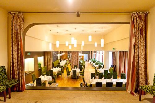 a view of a lobby with chairs and tables at Gasthof Post in Sankt Gallen