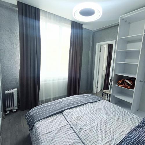 a bedroom with a bed and a window at Studio in Chakvi in Chakvi