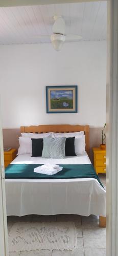 En eller flere senger på et rom på Recanto do Turista