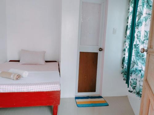 Tempat tidur dalam kamar di Glenmark's Homestay