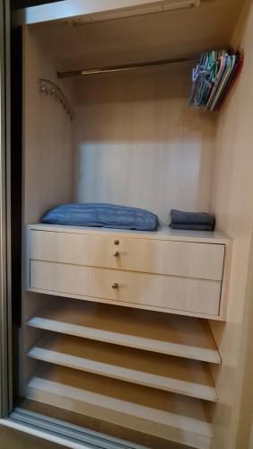 a closet with two drawers and a bed in it at 1BR Thonglor , Fast WiFi , Near Samitivej , Nightlife in Klong Toi