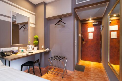 Postel nebo postele na pokoji v ubytování Fragrance Hotel - Kovan