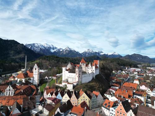 an aerial view of a town with mountains in the background at Old Town Residence Schlossblick I Küche I Central in Füssen
