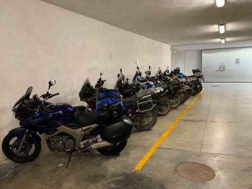 a row of motorcycles parked in a garage at B&B Eremes in Cuneo