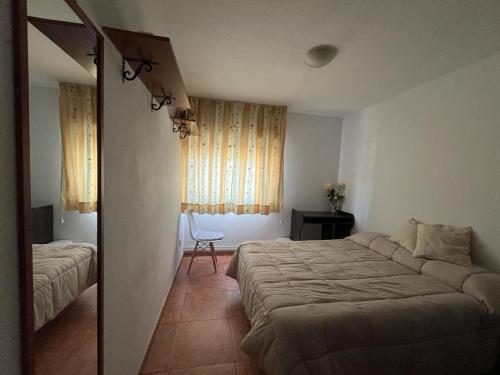 מיטה או מיטות בחדר ב-La casa de Antonia