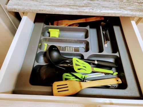 a drawer filled with cooking utensils in a counter at GUEST HOUSE NONA in Chakvi