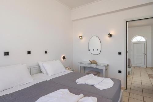 Ένα ή περισσότερα κρεβάτια σε δωμάτιο στο Hotel Caretta Beach