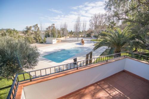 a view of a pool from the balcony of a house at Casa Rural Mirador 2 in Bullas