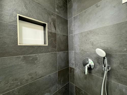 a bathroom with a shower with a window at Hotel Residenz WALDOASE in Ahlbeck