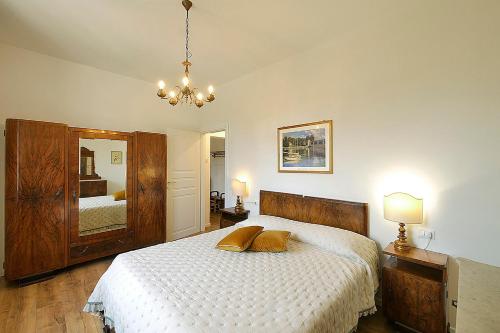 a bedroom with a bed with two pillows on it at Appartamento La Stazione in Donoratico