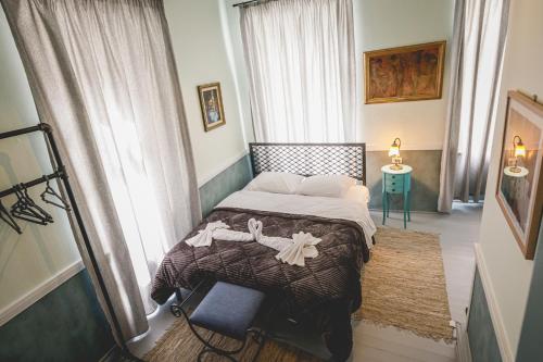 a bedroom with a large bed in a room at pension Acronafplia ( building C ) in Nafplio