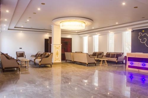 a large lobby with chairs and a pool table at Hotel Dekiling by Ladakh lodge Group in Leh