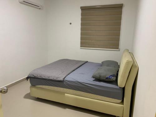Letto o letti in una camera di Desaru Homestay Southern, Tiara Desaru Seaview Residensi