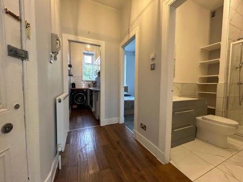 a bathroom with a toilet and a sink at Howburn Place in Aberdeen