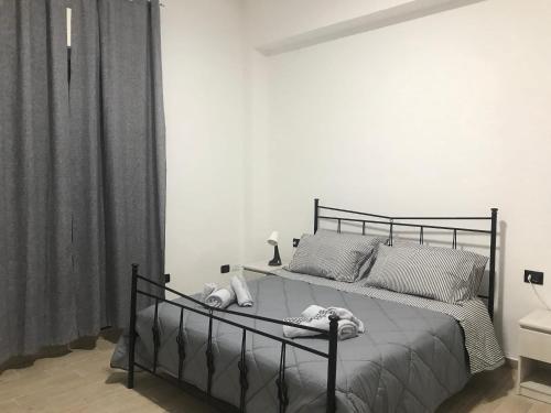 a bedroom with a bed with a black frame at One bedroom apartement with balcony and wifi at Ribera in Ribera