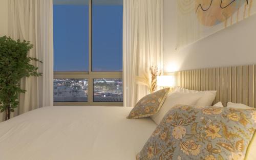 Katil atau katil-katil dalam bilik di Nathan's Suites On The Beach
