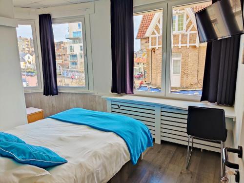 Postel nebo postele na pokoji v ubytování Hotel Sfinx