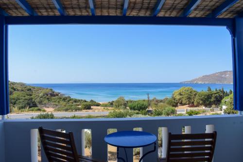 a view of the ocean from the balcony of a house at Villa Maniati Studios in ayios Petros