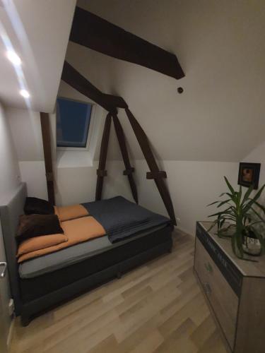 a bedroom with a bed in a room at Modern loftsleilighet in Fredrikstad