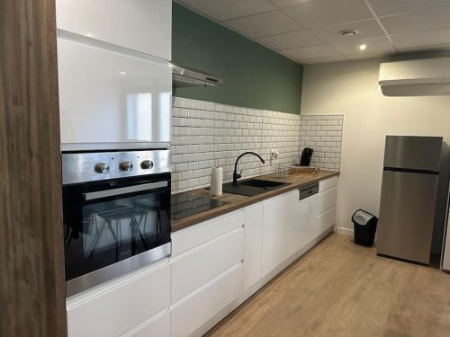 Een keuken of kitchenette bij Appartement 3 pièces