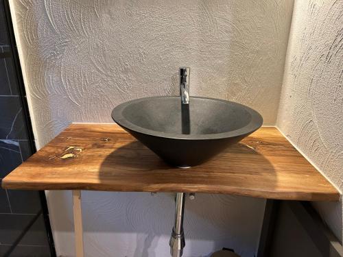 a sink sitting on top of a wooden counter at Cacele - La croisette 5 appartementen en 6 tweepersoonskamers in Vresse-sur-Semois