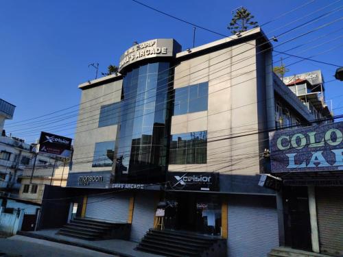 a building with a sign on the front of it at XCELSIOR HOTEL & SPA in Shillong