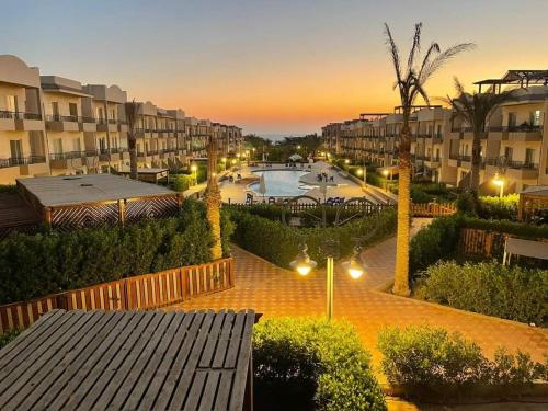 a view of a courtyard with a pool and buildings at TAVIRA Rass Suder"For Family" in Raʼs Matarma