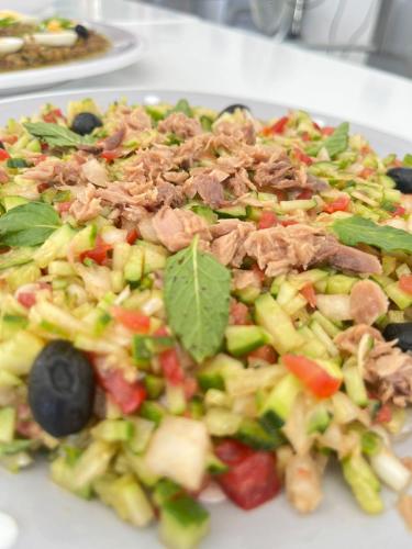 a salad with meat and vegetables on a white plate at Maison des Oliviers, Yasmine Hammamet, Bouficha in Hammamet Sud