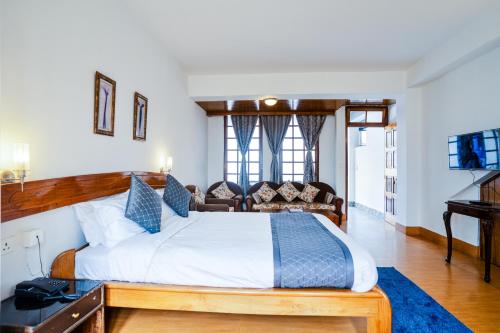 Ένα ή περισσότερα κρεβάτια σε δωμάτιο στο Sparrow Cherry Resort 2 min walk To MG Marg