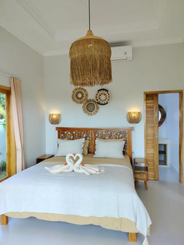 Postel nebo postele na pokoji v ubytování Padi-Padi Pool Villas