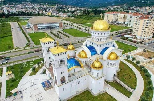 an aerial view of a mosque with gold domes at Meri in Bar