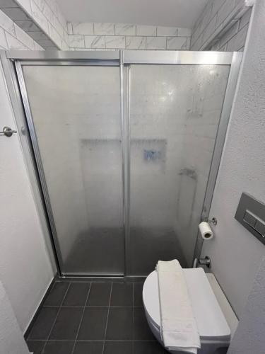 a shower stall with a toilet in a bathroom at DreamInn Bodrum in Bodrum City
