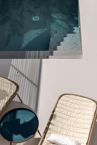 a room with a chair and a painting and a mirror at Palazzo Console in Lecce
