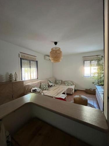 a living room with a bed and a couch at Apartamento en Las Negras in Las Negras