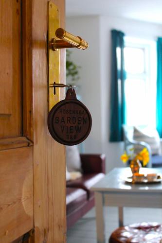 a sign is hanging on the door of a room at Rosenhøj Bed and Breakfast in Svendborg
