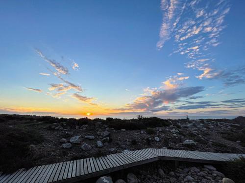 a view of the sunset from the roof of a house at Magical Mongoose in Jacobs Bay