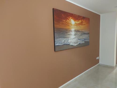 a painting hanging on a wall in a room at Casina Arianna in Leverano